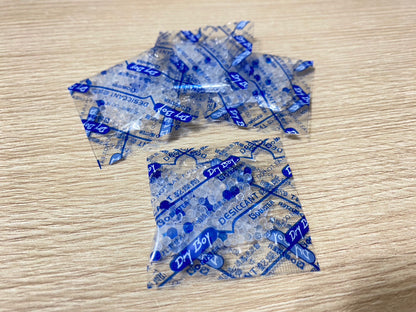 a blue vase filled with blue and blue flowers 