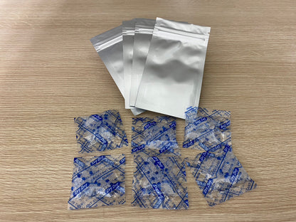 a blue and white paper bag sitting on top of a table 